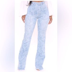 Denim bell bottom jean with detailed design.